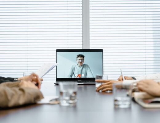 A diverse group participates in a virtual meeting using modern technology.