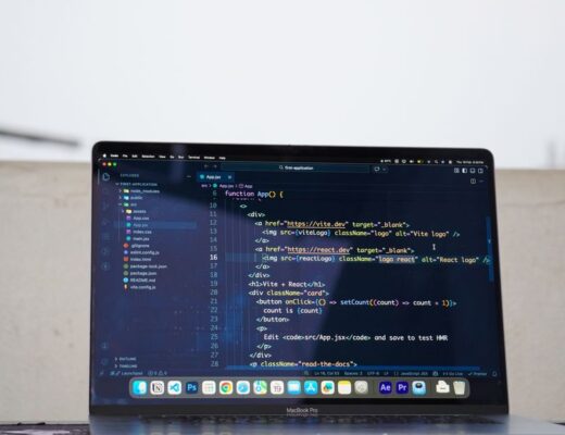 Laptop displaying code outdoors, ideal for remote work or freelance programming.