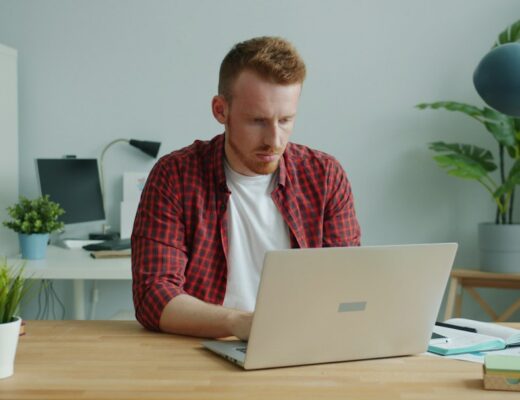 Man working on a laptop at a desk