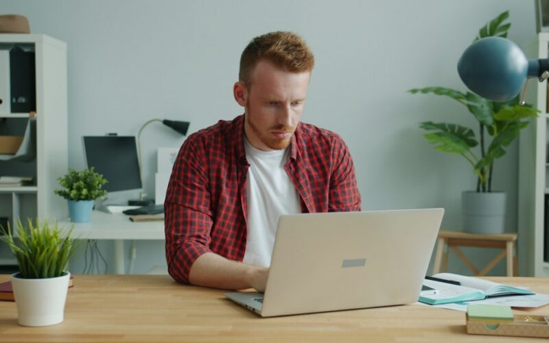 Man working on a laptop at a desk